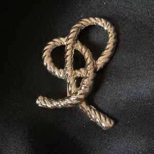 Brooch gold colored knot- costume jewelry